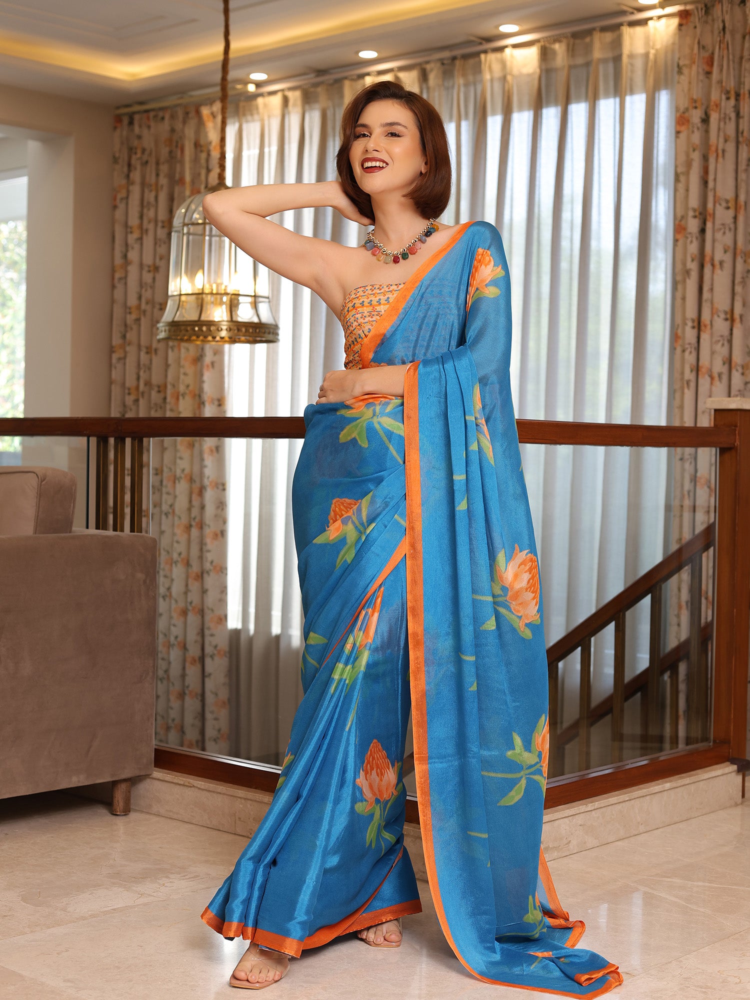 Soraya Azure Blue and Orange Floral Chinon Saree
